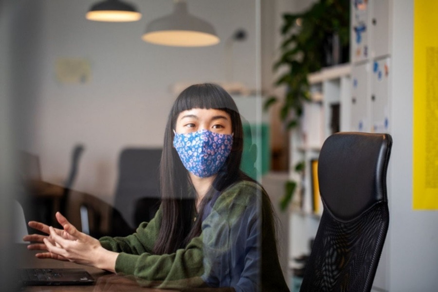 Woman at work wearing mask in Australia